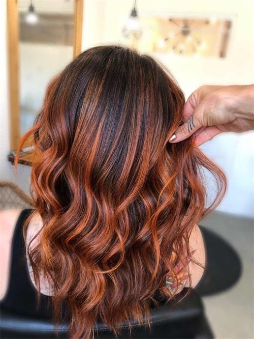 You can use as much copper as you want and keep the roots dark for a gorgeous growth-mixed look. Add some blonde hair in the summer months as well.