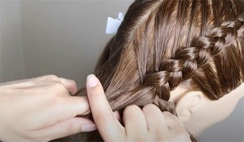 You can stop braiding when your braid reaches about halfway up the top of your head. Of course, you can continue the braid to the base of your scalp