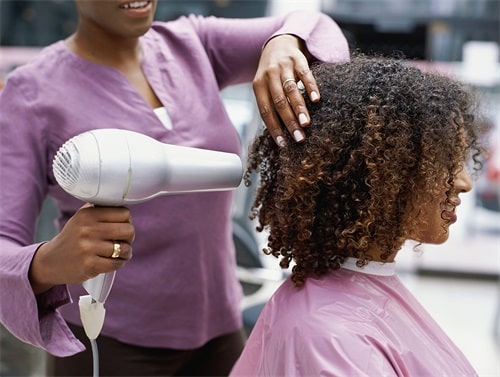 Blow dry the remaining hair in sections