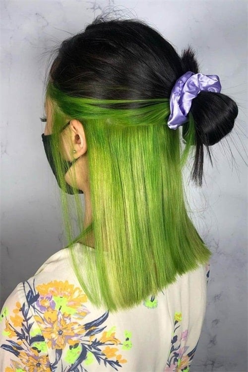 The underdye hair trend is to apply bright hair dye to the back of your neck